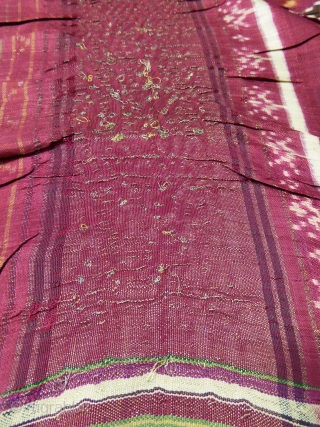 Early nineteenth century

India

Sumptuous red double silk woven shawl called Patola from India. Repetition of geometric patterns (hearts, flowers and stars) in cream, green and ocher drawing lozenges.
Borders of stripes and geometric friezes.  ...