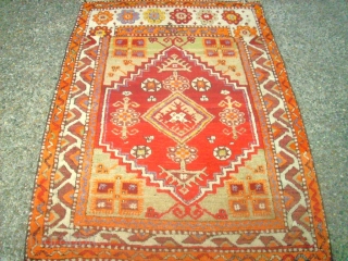 Old anatolian rug. Size: 89 x 124 cm. In good condition. I think that the one border is not re-notted, it is original.          