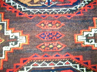 Antique Baluch rug. Size: 107 x 208 cm. With Camel-Wool. One small repair. One small area with thin pile.              