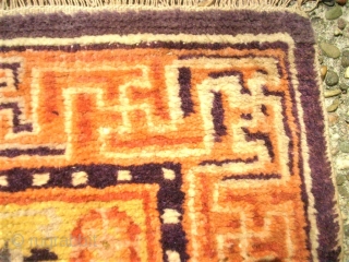 antique Tibet / Chinese sitting-meditation rug. Size: 61 x 183 cm. Some low pile.                   