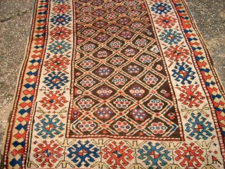 Antique caucasian rug. Size: 116 x 222 cm. At one end some low pile. Interesting rug.                 