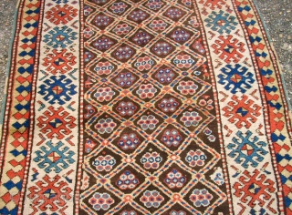 Antique caucasian rug. Size: 116 x 222 cm. At one end some low pile. Interesting rug.                 