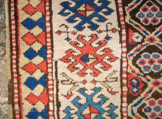 Antique caucasian rug. Size: 116 x 222 cm. At one end some low pile. Interesting rug.                 