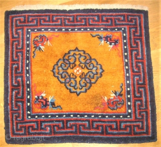 Pair of Tibetan / Chinese rugs. Size: 66 x 60 cm and 66 x 61 cm.                 