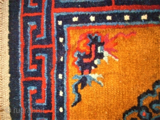 Pair of Tibetan / Chinese rugs. Size: 66 x 60 cm and 66 x 61 cm.                 