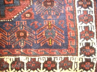 antique Baluch bagface. Size: 82 x 73 cm. Excellent wool. Fine knotting. Used. Some small repairs.                 