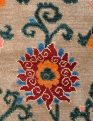 Beautiful Tibetan floral khaden (bed size rug) featuring two lotus’s - each growing out of Mount Meru, the mythical sacred mountain in Buddhist cosmology - with a bat ‘anchoring’ each of the  ...