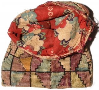 Central Asian silk purse, probably Uzbek or Turkoman, of indeterminate use. It is flat-woven and made of tightly stitched hand spun silk while the inside lining is of printed Russian cotton. Size  ...