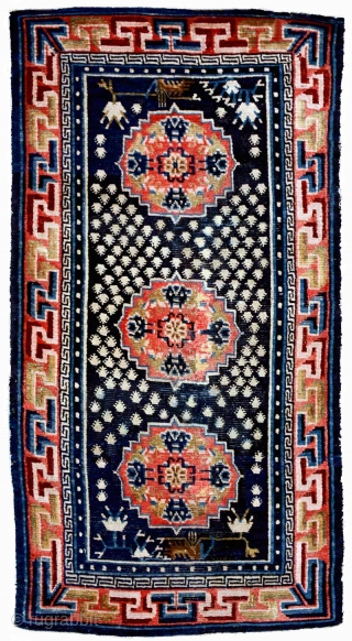 Three medallion Tibetan khaden with the belak (frogfoot / footprint of the frog) motif scattered throughout the center panel. The medallions have a floral center motif that is enclosed by a mandala  ...