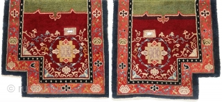 Striking Tibetan makden (‘under-saddle’ carpet) exhibiting a Khotan-like influence with an elaborate mandala motif surrounded by a fine trellis-like circular blue ‘necklace'. The main rose coloured outer border consist of alternating floral  ...