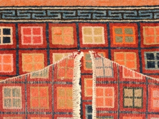 Striking trapezoidal shaped Tibetan carpet known as a takheb, which was meant for use as a horse or yak cover / blanket. The lower portion exhibits a multi coloured design, with multiple  ...