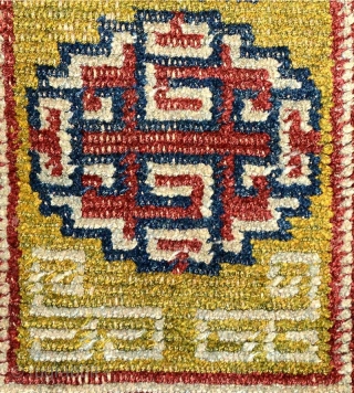 Beautiful richly saturated warp-faced-back large over-saddle carpet or 'masho', presumably from the Wangden valley region of Tibet, with two archaic mandala-like medallions in the center field. Made with very fine and particularly  ...