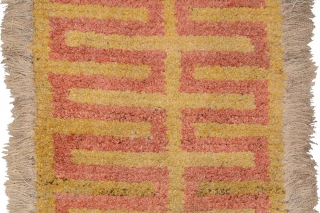 So-called ‘warp-faced-back’ runner (long carpet) woven in the Wangden valley region of Tibet. Given the colours, this thick heavy carpet with its red ladder-like design on a simple yellow background was most  ...