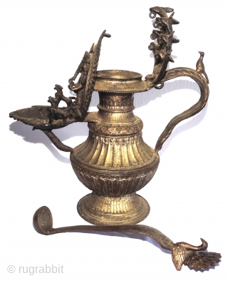 Asian art. Elaborately decorated museum quality gilded brass Newari oil lamp known as a Sukunda, hand crafted by an exceptionally gifted artisan in the late Malla period in Nepal, i.e. the 18th  ...