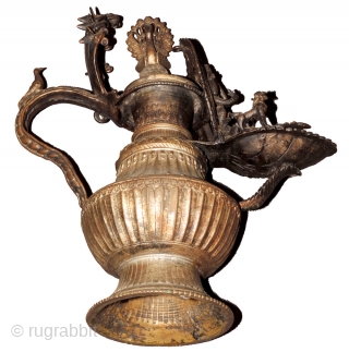 Asian art. Elaborately decorated museum quality gilded brass Newari oil lamp known as a Sukunda, hand crafted by an exceptionally gifted artisan in the late Malla period in Nepal, i.e. the 18th  ...
