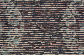 An elegant but subtle two-toned naturally dyed Tibetan seating carpet. A simple turquoise coloured ‘T’ border encases an uncomplicated dark blue central field set with turquoise rosettes, or roundels. It has good  ...