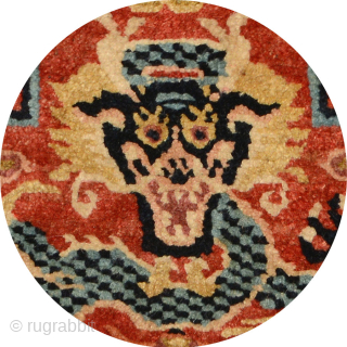 Rare Tibetan-knotted throne back or 'seating-back' carpet most likely made for a Buddhist lama associated with one of the 'red hat' Buddhist sects in Tibet. All three dragons are superbly drawn in  ...