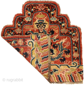 Rare Tibetan-knotted throne back or 'seating-back' carpet most likely made for a Buddhist lama associated with one of the 'red hat' Buddhist sects in Tibet. All three dragons are superbly drawn in  ...