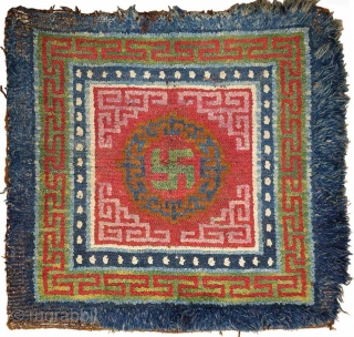 This khagangma, or Tibetan seating square, is simply nothing short of an extraordinary example of Tibetan woven art. Stunningly beautiful, relatively large and in unaltered original condition, it has a central yundrung  ...