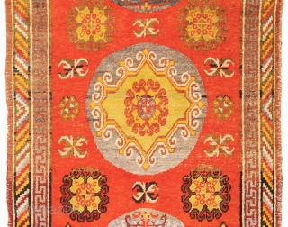Striking East Turkestan three medallion carpet, probably from either Khotan or Yarkand, which are both ancient oasis towns on the southern branch of the Silk Road in what is today Xinjiang, the  ...