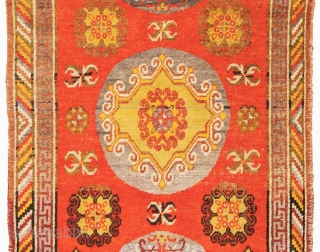 Striking East Turkestan three medallion carpet, probably from either Khotan or Yarkand, which are both ancient oasis towns on the southern branch of the Silk Road in what is today Xinjiang, the  ...