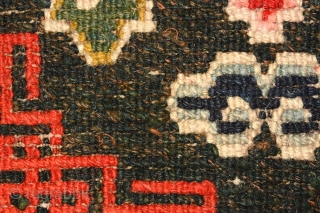 Beautiful richly coloured naturally dyed Tibetan seating carpet. The three dimensional 'Greek T' main border encloses an inner secondary border with crosses that mimic the tie-dyed tigma pattern much beloved by Tibetans,  ...