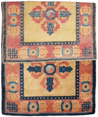 Symbolically powerful carpet from the Ningxia region of China featuring in the center field a pilgrim’s, or truth-seekers, gourd and staff between two double, or crossed, dorje's (visvavajra’s), both with the yin  ...