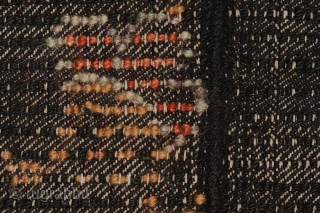 Tibetan three paneled black tsuktruk with a Zeepa (Dzeepa, Zeepak, et al) as the sole central motif, and with spray coming off a wave-like design set across the bottom. These blanket-like rugs are  ...