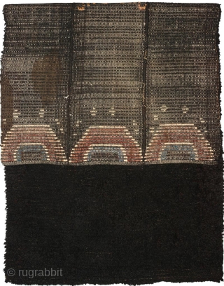 Tibetan three paneled black tsuktruk with a Zeepa (Dzeepa, Zeepak, et al) as the sole central motif, and with spray coming off a wave-like design set across the bottom. These blanket-like rugs are  ...