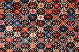 Sensational Tibetan takheb intended for use as a horse or yak cover / blanket, with an elaborate, visually stunning, multi-coloured flower-head design arranged in a lattice-like pattern throughout the main field. The  ...