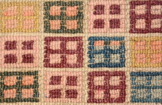 Slightly over-sized Tibetan khaden, although not quite sapden size, featuring rows of window-like motifs (a very early version of Windows 95 maybe?) in a multitude of subtle colours on a lustrous wool  ...