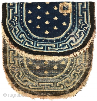 Very unusual Tibetan saddle carpet. What at first glance looks like your ‘normal’ oval shaped under-saddle carpet (that is, two halves simply stitched together across the centre join), this piece is intriguingly  ...