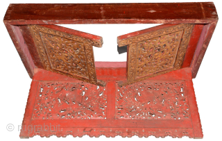 Folding ‘altar table’ that a Tibetan Lama (a Buddhist 'priest') would have taken with him on his travels to use when performing sacred rituals. Each ‘face’ (front and sides) is made of  ...