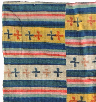 Large Tibetan or Bhutanese ‘blanket’ that, when used in Bhutan, was worn as a wrap around women's garment. Made of eleven striped multi-coloured panels – with yellow and off-white featuring the tigma  ...