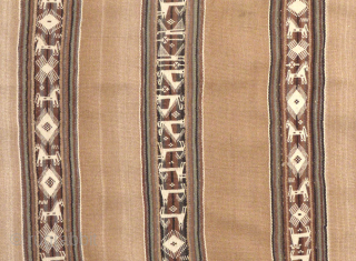 An exemplary ceremonial poncho from the Charazani village area, Department of La Paz, Bolivia, South America. The tan camelid fibre used in this piece comes from the Vicuna, a relative of the  ...