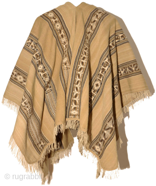 An exemplary ceremonial poncho from the Charazani village area, Department of La Paz, Bolivia, South America. The tan camelid fibre used in this piece comes from the Vicuna, a relative of the  ...