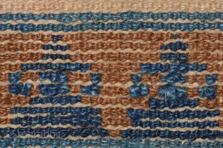 Small carpet from the Baotou region of China that, given the tigma (cross) design in the striped central field, was probably intended for Tibet. Outer border of interlocking swastikas with over-layed flowers  ...