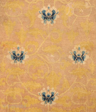 A very old Chinese carpet made in either the Ningxia or Beijing region in the 1700's / 18th century. The design in the golden-yellow center field is elegantly fashioned and features eight  ...