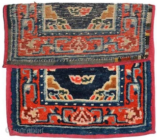 Complete two piece set of Tibetan saddle carpets with a matched design, that is both the under-saddle (makden) and over-saddle (masho) carpets, which are increasingly rare to find as an intact set  ...