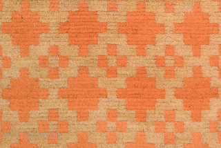 Two toned Tibetan khaden that uses a repeating ‘gau box’ (or amulet) motif as the design, with a mild abrash through both the orange and tan colours and which, given the predominate  ...