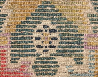 Striking Tibetan khaden with a lovely abrashed strawberry-red border and two shades of saturated abrashed green in the center field. A rare design ‘twist’ is the asymmetric nature of the design in  ...