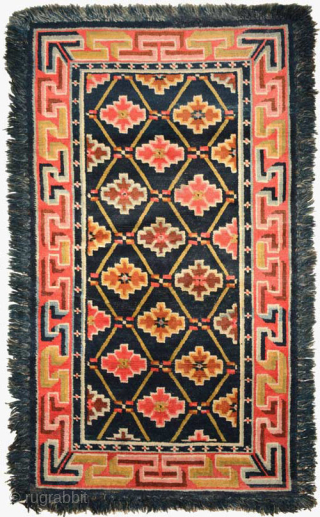 Matched pair of fringed Tibetan carpets. Both carpets have cotton warp and wool weft, the dyes are primarily natural and they were made circa the 1920's. Sizes are 152cm x 93cm (approx.  ...