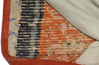 This Tibetan 'butterfly' shaped makden, or under-saddle carpet, features a rare depiction of tigers in place of the snow-lions sometimes seen in the same configuration (on makdens), while sinuous dragons encircle the  ...