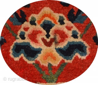Tibetan takyeb (pack animal forehead ‘decoration’) featuring a large flower - surrounded by ‘wish-fulfilling’ flaming jewels in the main field - emanating from a vase also filled with flaming jewels. Hand spun  ...