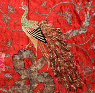 Elegant 19th century Chinese “Yue” embroidered* silk peacock banner using finely woven coloured silk threads, and wafer-thin silver encased silk threads, on a red silk panel. The super-fine embroidery and expert blending  ...