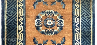 An unusual floral piece, from the Baotou-Suiyuan region of China, in that as opposed to the usual predominately blue colour, it has a central un-dyed brown camel hair field, which the floral  ...