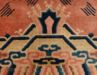 The end fragment of a longer carpet, most likely made in the Baotou-Suiyuan region of China circa the early 1900’s, and which has (much more recently) been professionally mounted so as to  ...