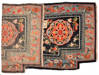 Tibetan under-saddle carpet or ‘makden’ with an uncommon main motif roundel, referred to by some as a Khotan roundel or a ‘Khotan influenced’ roundel (because of its likeness to similar motifs found  ...