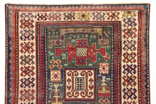 Antique kazak rug with remarkable design in excellent condition. Karachopf long rug elements along with a pair of large elegantly dressed people. Allover good even pile with good edges and ends. All  ...