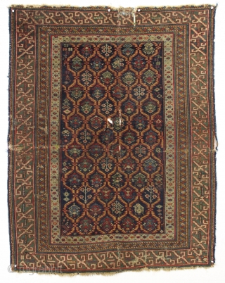 Early east caucasian rug in distressed condition. Lovely green border and a nicely drawn colorful lattice with a large variety of delicate inset elements. Rug is cut and crudely resewn lenghtwise. A  ...